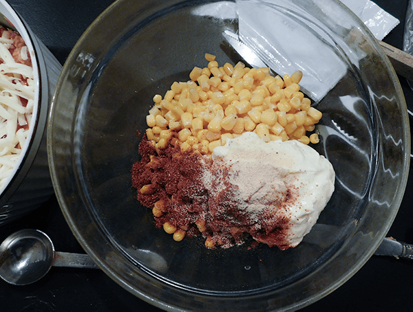 Corn, mayo and spices for the 5th layer of the Corn Dip