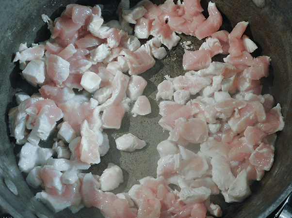 Chopped Chicken cooking in a Dutch Oven