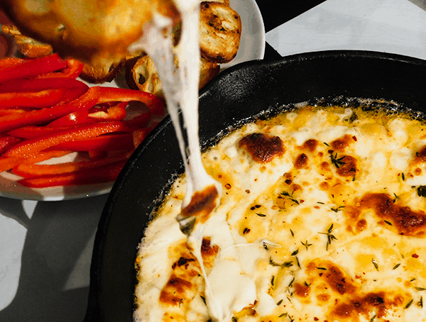 Baked Fontina with toast and red peppers