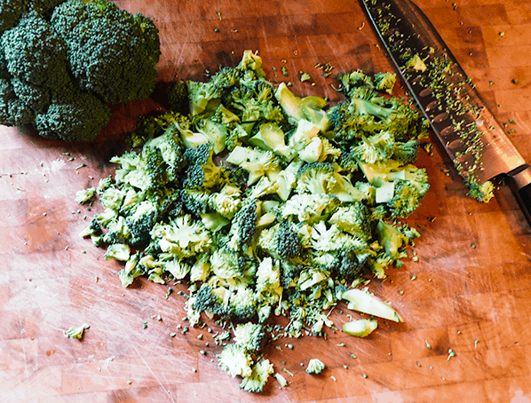 chopped broccoli prepping for Creamy Broccoli Soup 