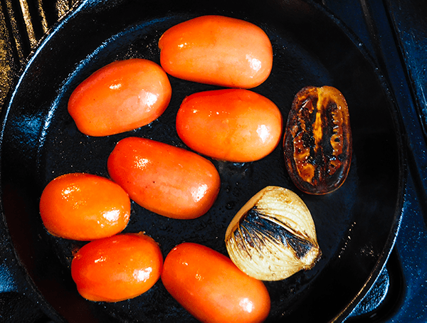 Partially cooked tomatoes and onion