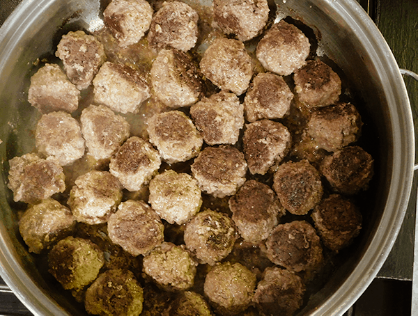 Mexican meatballs browning in saute pan