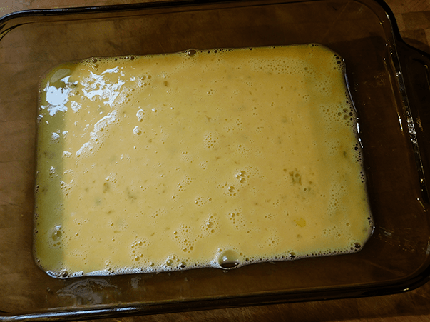 Casserole pan with eggs, milk and fireball mixed together. 