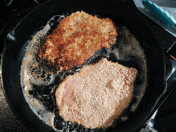 Pokr Milanese cooking on the stove